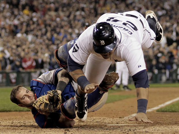 Miguel Cabrera is tagged out by Mike Napoli at home plate 