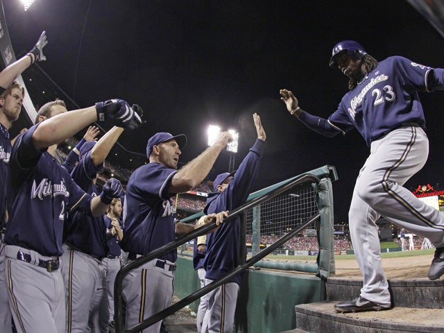 Rickie Weeks is congratulated after scoring  
