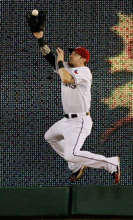 Josh Hamilton catches a fly ball  