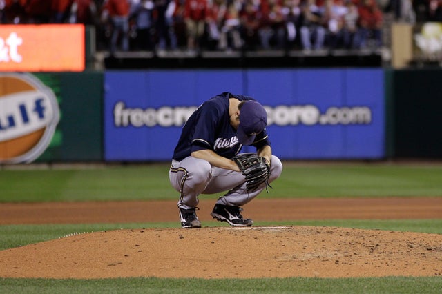 Zack Greinke hangs his head down on the mound 