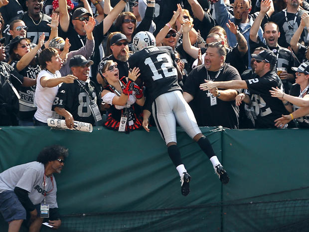 Jacoby Ford jumps in to the stands 