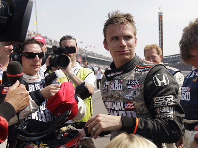 Dan Wheldon speaks with reporters 