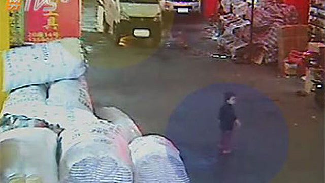 Yueyue, a 2-year-old, moments before she is hit by a truck in Foshan City in China. 