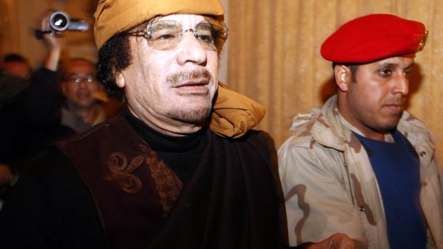 In this March 8, 2011, file photo, Libyan strongman Muammar Qaddafi arrives at the Rixos hotel in the capital of Tripoli. 