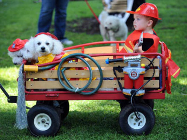 Two-year-old Kyle Lee rides in a wagon 