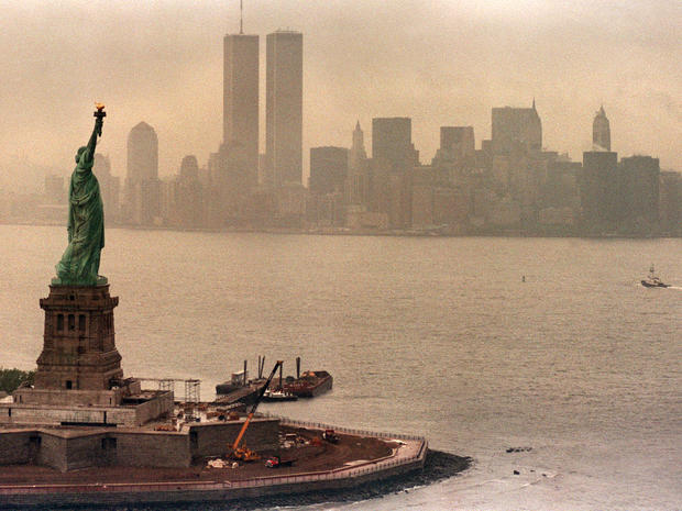 The Statue of Liberty is seen May 20, 1986, the year of the statue's centennial, with the twin towers of the World Trade Center in the background. 