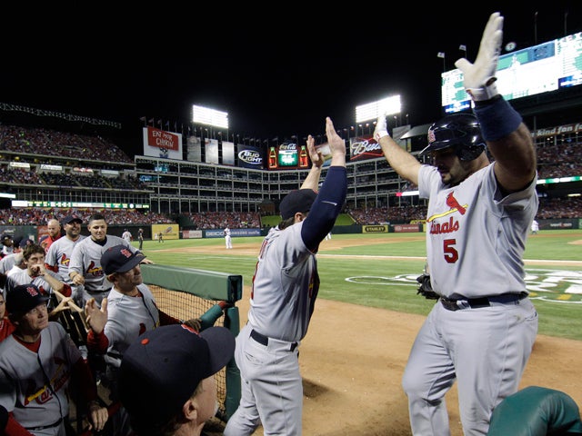 Albert Pujols celebrates with teammates 