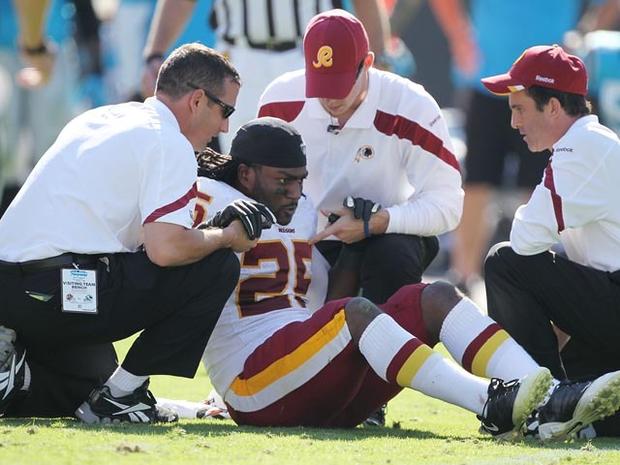 CHARLOTTE, NC - OCTOBER 23: Tim Hightower #25 of the Washington Redskins gets attention by the training staff after being injured in the second half of the game with the Carolina Panthers at Bank of America Stadium on October 23, 2011 in Charlotte, North Carolina. (Photo by Scott Halleran/Getty Images) 