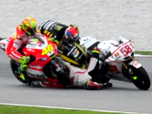 Crash between Colin Edwards, center, Valentino Rossi  