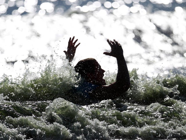 Sebsatian Harmsen reacts after taking a fall in the men's wakeboard fina 