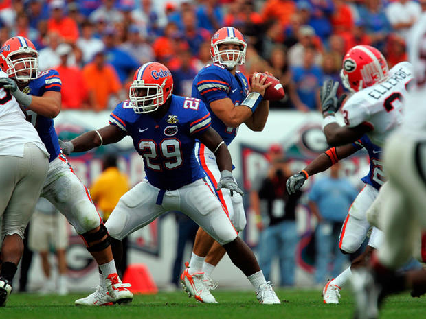 Tim Tebow drops back to pass  