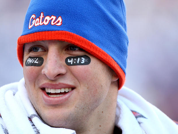 Tim Tebow smiles following a game 