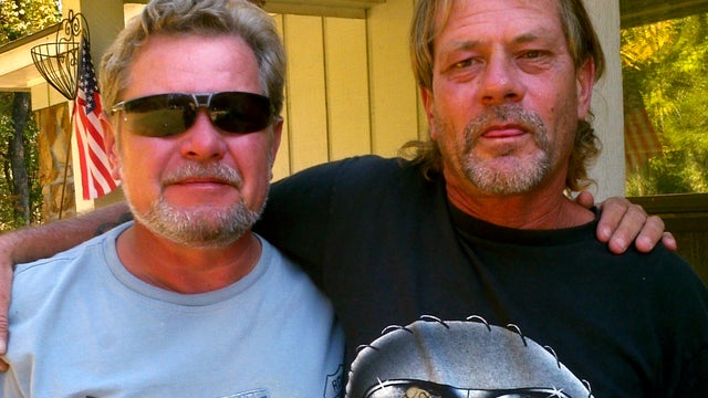 Harold Wayne Lovell, right, and his brother, Tim, pose for a photo during a family reunion in Ozark, Ala., Oct. 25, 2011, in this photo provided by Theresa Hasselberg. Harold, whose family had long feared he was a victim of serial killer John Wayne Gacy,  