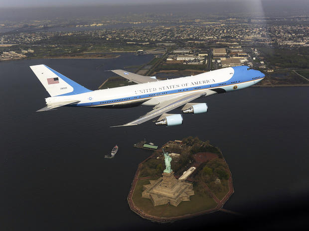 An Air Force presidential airplane flies over the Statue of Liberty April 27, 2009, in New York Harbor in this handout picture from the White House. White House military aide Louis Caldera, who reportedly authorized the flyover, resigned May 8, 2009, afte 
