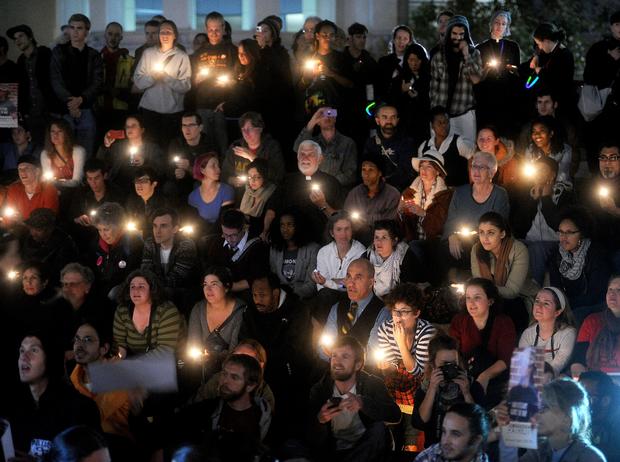 About 1300 hundred people attend a candlelight vigil for Scott Olsen on Thursday, Oct. 27, 2011, in Oakland, Calif. During an Occupy Oakland protest Tuesday night, a projectile apparently fired by police struck the Iraq veteran in the head leaving him in critical condition with a fractured skull. 