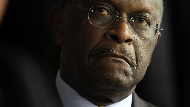 DES MOINES, IA - OCTOBER 22: Republican Presidential Candidate Herman Cain listens to speakers at the Iowa Faith & Freedom Coalition Presidential Forum on October 22, 2011 in Des Moines, Iowa. Candidates Herman Cain, Michele Bachmann, Rick Perry, Newt Gin 