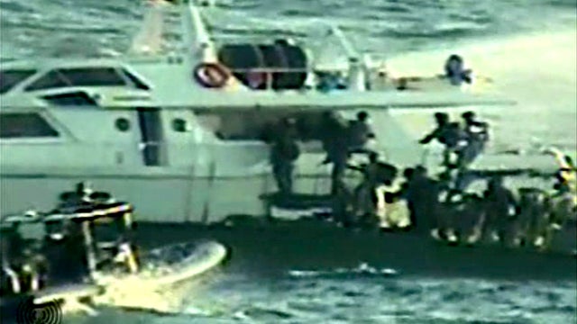 Israeli soldiers on several small military boats appear to board a civilian boat believed to be one of two protest boats trying to violate Israel's blockade of the Gaza Strip in this video image released by the Israeli Defense Ministry Nov. 4, 2011. Israe 