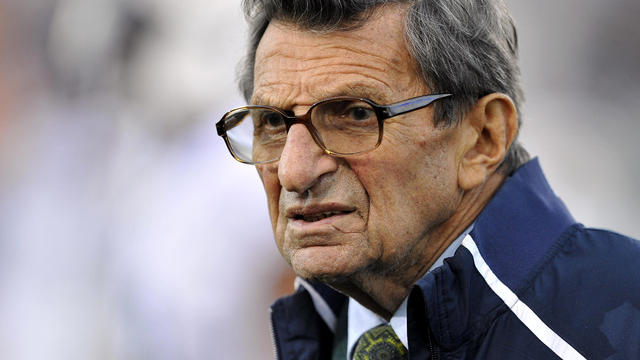 Penn State football coach Joe Paterno stands on the field before his team's NCAA college football game against Northwestern in Evanston, Ill., Oct. 22, 2011. Paterno has decided to retire at the end of the season. 