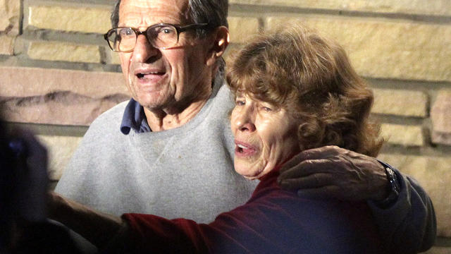 Joe Paterno and his wife Susan stand on their porch to thank well-wishers gathered outside in State College, Pa., Nov. 9, 2011. The Penn State Board of Trustees fired Paterno as football coach. The board also fired the university's president, Graham Spani 