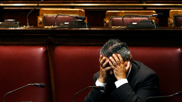 An unidentified deputy sits in an empty Italian Lower House before a debate to approve the last package of economic reforms in Rome Nov. 12, 2011. 