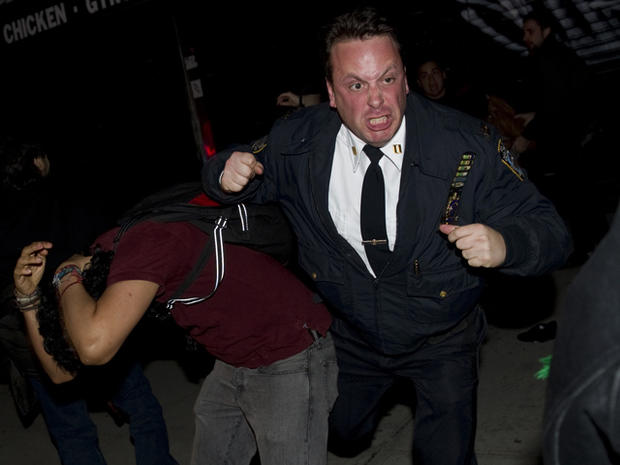 police officer scuffles with Occupy Wall Street protesters  