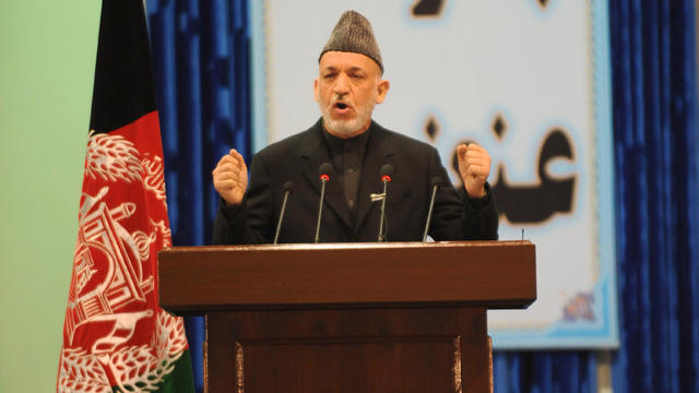 Afghan President Hamid Karzai addresses a loya jirga 