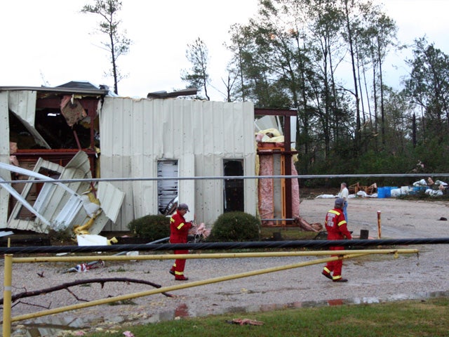 firefighters finish a walk-through in the heavily-damaged buidling 