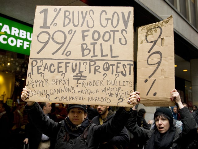 Occupy Wall Street protesters march near the New York Stock Exchange Nov. 17, 2011, in New York. Some 1,000 protesters converged on Wall Street, and fights erupted outside the stock exchange amid a tense face-off with police. 