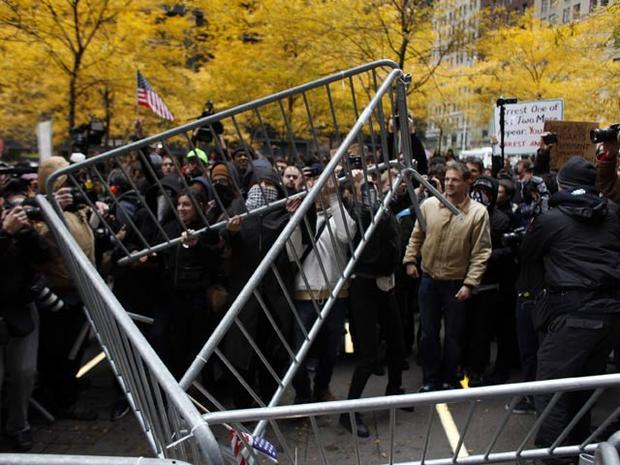 Occupy Wall Street protesters remove police barricades in Zuccotti Park Nov. 17, 2011, in New York City. Hundreds of protesters attempted to shut down the New York Stock Exchange, blocking roads and tying up traffic in lower Manhattan. 