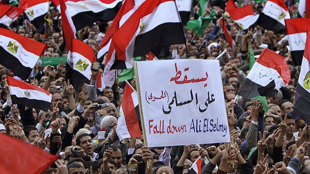 Protesters shout anti-military ruling council slogans in Tahrir Square, the focal point of the uprising that ousted President Hosni Mubarak, in Cairo, Egypt, Friday, Nov. 18, 2011.   