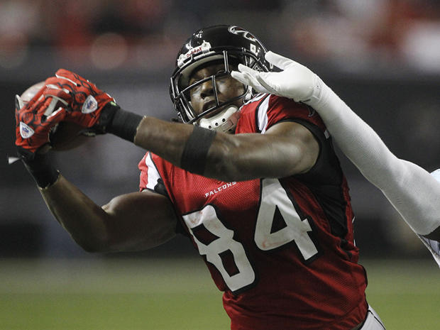 Roddy White catches a pass in front  