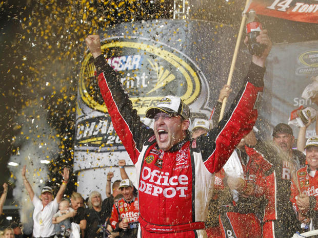 Tony Stewart celebrates after winning the NASCAR Sprint Cup Series 