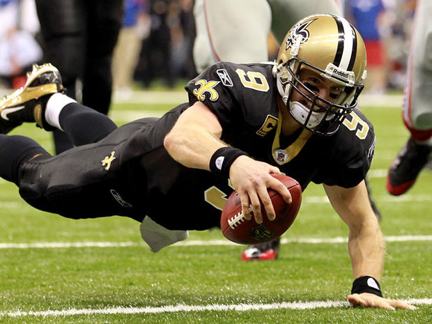 Drew Brees dives into the endzone for a touchdown 