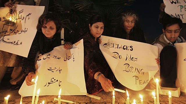 Pakistanis light candles during a protest to condemn NATO attacks on Pakistani troops, in Islamabad, Pakistan, Nov. 29, 2011 