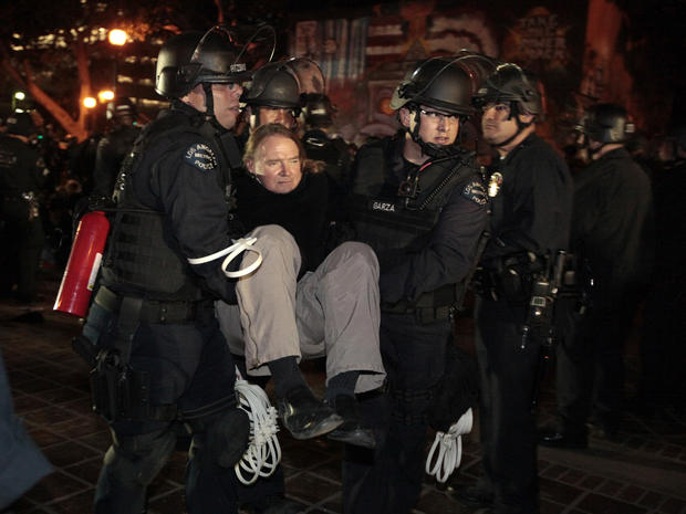 A protester is arrested as Los Angeles police officers evict protesters from the Occupy Los Angeles camp 