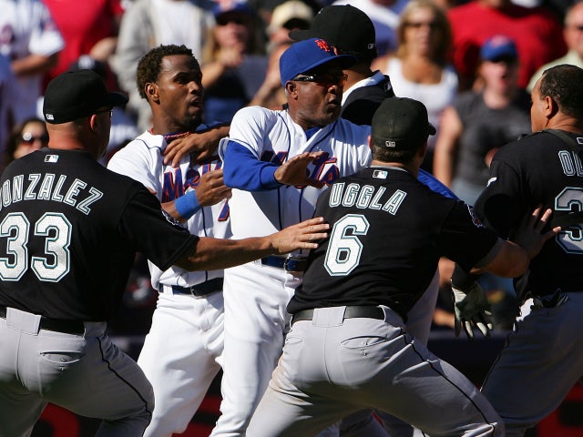 Miguel Cabrera holds back Jose Reyes 