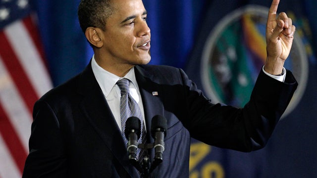 President Obama addresses gestures while speaking at Osawatomie High School in Osawatomie, Kansas, Tuesday, Dec. 6, 2011. Obama was in Kansas to deliver a major speech on the economy. 