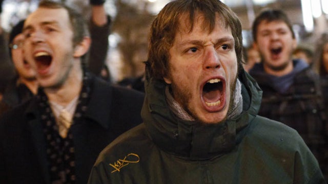 Young protesters shout anti-Putin slogans during protests against alleged vote rigging in Russia's parliamentary elections in Triumphal Square in Moscow, Russia, Dec. 6, 2011. 