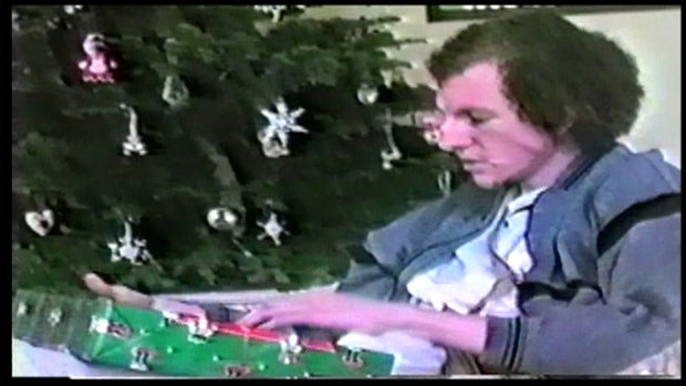 Suspects caught on tape opening the Tiede family's Christmas gifts.  