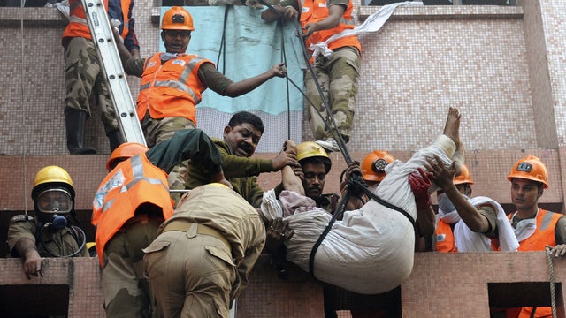 Rescuers use ropes to get people out of burning India hospital 