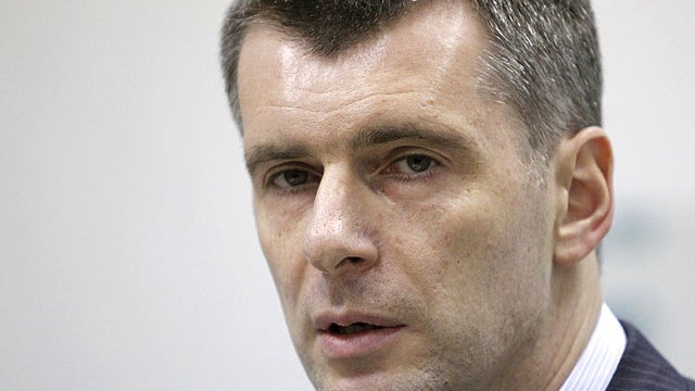 Mikhail Prokhorov, one of Russia's richest tycoons and New Jersey Nets basketball team owner, speaks at a press conference in Moscow, Russia, Monday, Dec. 12, 2011, as he announces his candidacy to run against Russian Prime Minister Vladimir Putin in the  