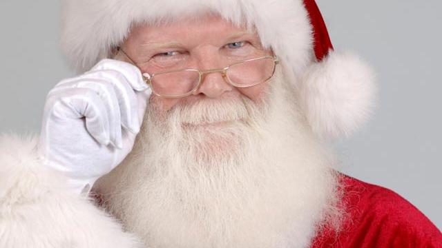 Santa peers over his glasses to see who is naughty and who is nice. 