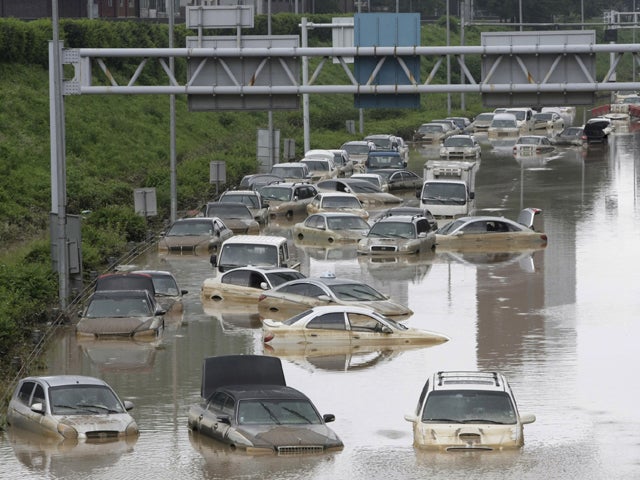 Vehicles are submerged in floodwater 