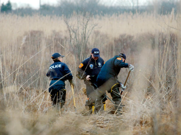 Investigators use metal detectors to search a marsh for the remains of Shannan Gilbert  on Dec. 12, 2011 in Oak Beach, N.Y. 