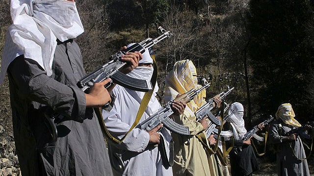 In this Dec. 11, 2011 photo, masked Pakistani Taliban militants take part in a training session in an area of Pakistan's tribal South Waziristan region along the Afghan border.  