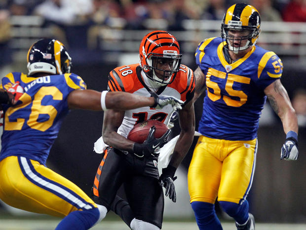 A.J. Green runs with the ball between Rams defenders 