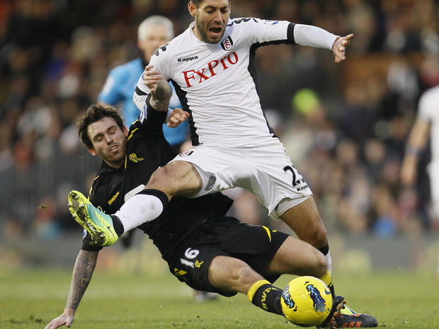 Clint Dempsey challenges for the ball  