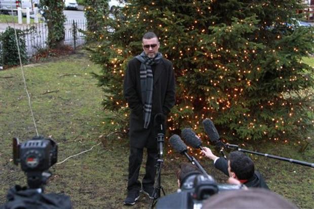 After being hospitalized for pneumonia, George Michael arrives back at his home in London on Dec. 23, 2011. 