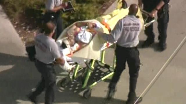 police-involved-shooting-victim-on-stretcher.jpg 