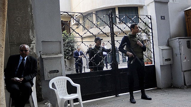  Egyptian soldiers stand guard in front of the U.S. National Democratic Institute, an NGO (non-governmental) rights group in downtown Cairo on December 29, 2011.  